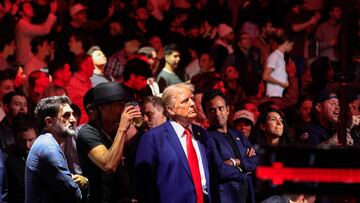 US President-elect Donald Trump, singer Kid Rock and US entrepreneur Vivek Ramaswa stand up after UFC Heavyweight Champion Jon Jones' TKO victory against challenger Stipe Miocic in the UFC 309 heavyweight title bout at Madison Square Garden in New York, on November 16, 2024. US President-elect Donald Trump was greeted by chanting fans as he attended the Ultimate Fighting Championship heavyweight bout at New York's Madison Square Garden on November 16.
Trump entered the arena shortly before the start of the main card accompanied by UFC chief executive Dana White, who was a prominent backer during his election campaign.
Several political allies of Trump were also in attendance including entrepreneurs Elon Musk and Vivek Ramaswamy, who have been asked by Trump to lead efforts to cut government inefficiency. (Photo by Kena Betancur / AFP)