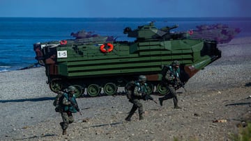 PINGTUNG, TAIWAN - JULY 28: Soldiers disembark from AAV7 amphibious assault vehicles during the Han Kuang military exercise, which simulates China's People's Liberation Army (PLA) invading the island, on July 28, 2022 in Pingtung, Taiwan. Taiwan military launches five days of live fire drills involving all forces of the military to repel simulated attacks from China. (Photo by Annabelle Chih/Getty Images)