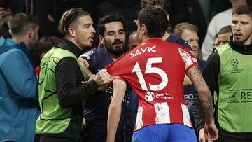 MADRID, SPAIN - APRIL 13: Stefan Savic of Atletico Madrid and Jack Grealish of Manchester City argue during the UEFA Champions League quarter final second leg soccer match between Atletico Madrid and Manchester City at the Estadio Wanda Metropolitano in Madrid, Spain on April 13, 2022. (Photo by Burak Akbulut/Anadolu Agency via Getty Images)