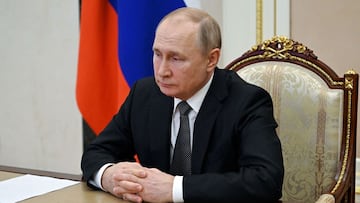 Russian President Vladimir Putin chairs a meeting with members of the Security Council via teleconference call at the Novo-Ogaryovo state residence outside Moscow, on February 18, 2022.