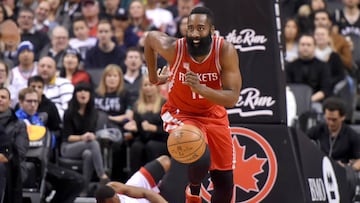 Jan 8, 2017; Toronto, Ontario, CAN; Houston Rockets guard James Harden (13) dribbles the ball up court after winning a rebound from Toronto Raptors guard Kyle Lowry (7) in the first half at Air Canada Centre. Mandatory Credit: Dan Hamilton-USA TODAY Sports