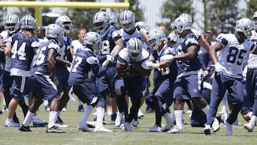 May 24, 2017; Frisco, TX, USA; Dallas Cowboys running back Rob Smith (45) is gang tackled during OTAs at the Star in Frisco. Mandatory Credit: Tim Heitman-USA TODAY Sports