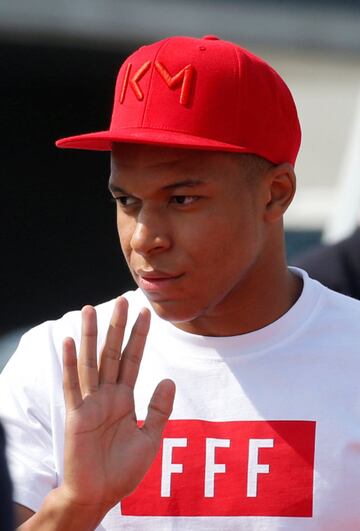 The France team return from the World Cup in Russia - Charles de Gaulle Airport, Paris, France - July 16, 2018 France's Kylian Mbappe waves as he arrives