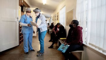 Doctors (L) stand at the Respiratory & Meningeal Pathogens Research Unit (RMPRU) at the Chris Hani Baragwanath Hospital in Soweto on July 14, 2020. - Six senior clinicians in the Faculty of Health Sciences at Wits University have volunteered to partic