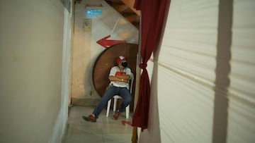 A man waits for Peru's presidential candidate socialist Pedro Castillo (not pictured), who leads in the polls ahead of a run-off vote on June 6 against right-wing opponent Keiko Fujimori, to arrive for a news conference, in Lima, Peru May 5, 2021. REUTERS/Alessandro Cinque