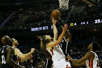 Basketball - NBA Global Games - Brooklyn Nets v Miami Heat - Arena Mexico, Mexico City, Mexico December 9, 2017. Kelly Olynyk of Miami Heat and Rondae Hollis-Jefferson in action. REUTERS/Edgard Garrido