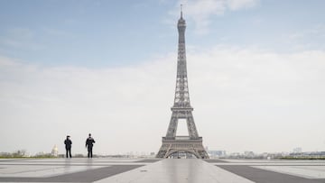 *** YEAR IN REVIEW - NEWS *** PARIS, FRANCE - MARCH 17: Police officers patrol near the Eiffel Tower during a government enforced quarantine on March 17, 2020 in Paris, France. On March 17, 2020 France imposed a nationwide lockdown to control the spread o