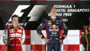 PROTAGONISTAS. El podio del GP de Singapur, con Vettel en el centro y a su lado Alonso y Raikkonen, quienes formar&aacute;n equipo en Ferrari.
 