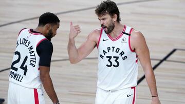 Toronto Raptors' Norman Powell (24) and Marc Gasol (33) talk during the first half of an NBA basketball game against the Boston Celtics Friday, Aug. 7, 2020 in Lake Buena Vista, Fla. (AP Photo/Ashley Landis, Pool)