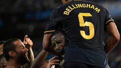 Real Madrid's German defender #22 Antonio Rudiger (C) celebrates a goal scored by Real Madrid's English midfielder #5 Jude Bellingham during the Spanish Liga football match between RC Celta de Vigo and Real Madrid CF at the Balaidos stadium in Vigo on August 25, 2023. (Photo by MIGUEL RIOPA / AFP)