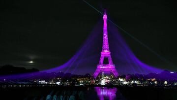 A picture taken on October 1, 2020 shows the Eiffel Tower illuminated in pink to mark the start of &quot;Octobre Rose&quot; (Pink October) or Breast Cancer Awareness Month in Paris (Photo by STEPHANE DE SAKUTIN / AFP)