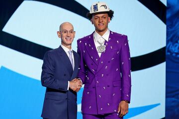 Paolo Banchero (right) shakes hands with NBA commissioner Adam Silver after being selected as the number one pick by the Orlando Magic.