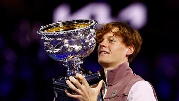 Tennis - Australian Open - Melbourne Park, Melbourne, Australia - January 28, 2024 Italy's Jannik Sinner celebrates with the trophy after winning the final against Russia's Daniil Medvedev REUTERS/Issei Kato