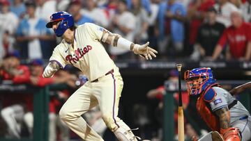Oct 6, 2024; Philadelphia, Pennsylvania, USA; Philadelphia Phillies outfielder Nick Castellanos (8) hits a single in the ninth inning against the New York Mets during game two of the NLDS for the 2024 MLB Playoffs at Citizens Bank Park. Mandatory Credit: Kyle Ross-Imagn Images