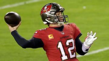 (FILES) In this file photo Quarterback Tom Brady #12 of the Tampa Bay Buccaneers looks to pass against the Washington Football Team during the first half of the NFC Wild Card playoff game at FedExField on January 9, 2021 in Landover, Maryland. - Six-time 