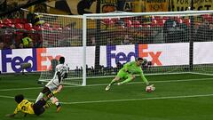 Dortmund's German forward #27 Karim Adeyemi shoots but fails to score past Real Madrid's Belgian goalkeeper #01 Thibaut Courtois and Real Madrid's German defender #22 Antonio Rudiger during the UEFA Champions League final football match between Borussia Dortmund and Real Madrid, at Wembley stadium, in London, on June 1, 2024. (Photo by Ben Stansall / AFP)