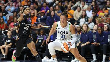 Oct 4, 2024; Uncasville, Connecticut, USA; Minnesota Lynx guard Kayla McBride (21) drives to the basket defended by Connecticut Sun guard DiJonai Carrington (21) during game three of the 2024 WNBA Semi-finals at Mohegan Sun Arena. Mandatory Credit: Paul Rutherford-Imagn Images