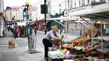 Kelly Wakeling arranges produce at her market stall ALK Fruit and Veg on Portobello Road, in London, Britain, May 30, 2022. REUTERS/Henry Nicholls