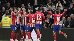 Atletico Madrid's Spanish midfielder #14 Marcos Llorente (2nd-R) celebrates with teammates after scoring his team's first goal during the Spanish league football match between Real Madrid CF and Club Atletico de Madrid at the Santiago Bernabeu stadium in Madrid on February 4, 2024. (Photo by Thomas COEX / AFP)