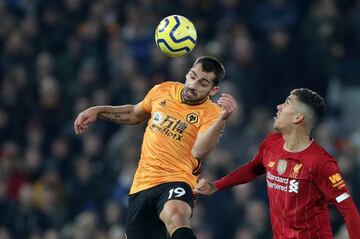 Wolverhampton Wanderers' Jonny in action with Liverpool's Roberto Firmino.