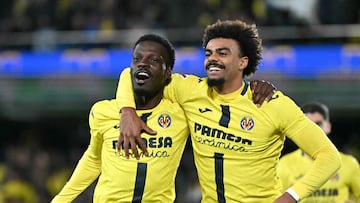 Villarreal's Canadian forward #21 Tani Oluwaseyi celebrates with Villarreal's Portuguese defender #12 Renato Veiga scoring his team's second goal during the Spanish league football match between Villarreal CF and RCD Mallorca at La Ceramica Stadium in Vila-real on November 22, 2025. (Photo by JOSE JORDAN / AFP)