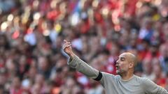 Manchester City's Spanish manager Pep Guardiola reacts during the English FA Cup semi-final football match between Liverpool and Manchester City at Wembley Stadium in north west London on April 16, 2022. - - NOT FOR MARKETING OR ADVERTISING USE / RESTRICTED TO EDITORIAL USE (Photo by Glyn KIRK / AFP) / NOT FOR MARKETING OR ADVERTISING USE / RESTRICTED TO EDITORIAL USE (Photo by GLYN KIRK/AFP via Getty Images)