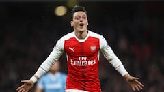 Özil stunner sends Arsenal top