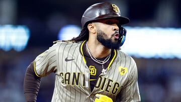 LOS ANGELES, CALIFORNIA - SEPTEMBER 25: Fernando Tatis Jr. #23 of the San Diego Padres hits a home run against the Los Angeles Dodgers in the fifth inning at Dodger Stadium on September 25, 2024 in Los Angeles, California. Ronald Martinez/Getty Images/AFP (Photo by RONALD MARTINEZ / GETTY IMAGES NORTH AMERICA / Getty Images via AFP)