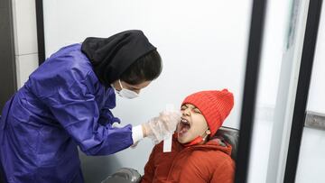 A medical staff member performs a PCR test as the coronavirus disease (COVID-19) cases spike, in Tehran, Iran January 30, 2022. Picture taken January 30, 2022. Majid Asgaripour/WANA (West Asia News Agency) via REUTERS ATTENTION EDITORS - THIS IMAGE HAS BE