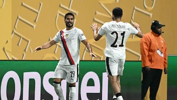Manchester City's German midfielder #19 Ilkay Gundogan (L) celebrates with teammate Algerian defender #21 Rayan Ait-Nouri after scoring his team's first goal during the FIFA Club World Cup 2025 Group G football match between England's Manchester City and UAE's Al Ain FC at the Mercedes-Benz stadium in Atlanta on June 22, 2025. (Photo by CHANDAN KHANNA / AFP)