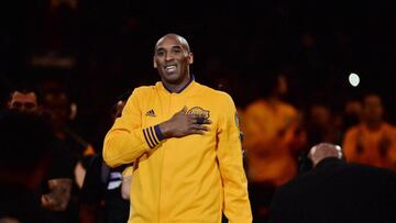 Apr 13, 2016; Los Angeles, CA, USA; Los Angeles Lakers forward Kobe Bryant (24) reacts to the crowd as he walks on the court before a game against the Utah Jazz at Staples Center. Bryant concludes his 20-year NBA career tonight. Mandatory Credit: Robert Hanashiro-USA TODAY Sports