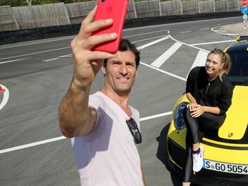 STUTTGART, GERMANY - APRIL 20:  Porsche Brand Ambassadors Maria Sharapova and Mark Webber take a selfie after driving with the high performance sports car Porsche 911 RT2 RS on the Weissach race track before the start of the Porsche Tennis Grand Prix tenn