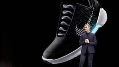 An image of the Nike HyperAdapt 1.0 behind Nike CEO Mark Parker.