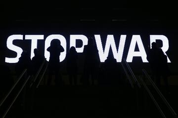 MADRID, SPAIN - FEBRUARY 26: Fans stand infront of an LED board with a message in protest at the war in Ukraine during the LaLiga Santander match between Club Atletico de Madrid and RC Celta de Vigo at Estadio Wanda Metropolitano on February 26, 2022 in M