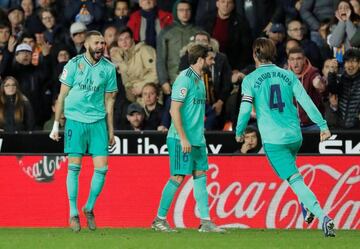 Sergio Ramos rushes to celebrate with Benzema after his late equaliser against Valencia.