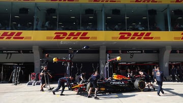Mechanics work on the car of Red Bull Racing's New Zealand driver Liam Lawson during the sprint qualifying session of the Formula One Chinese Grand Prix at the Shanghai International Circuit in Shanghai on March 21, 2025. (Photo by WU Hao / POOL / AFP)