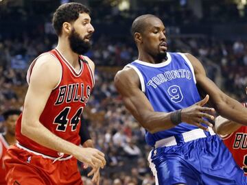 Mar 21, 2017; Toronto, Ontario, CAN; Toronto Raptors forward Serge Ibaka (9) tries to control the ball as Chicago Bulls forward Nikola Mirotic (44) and Chicago Bulls guard Rajon Rondo (9) defend during the first half at the Air Canada Centre. Mandatory Credit: John E. Sokolowski-USA TODAY Sports