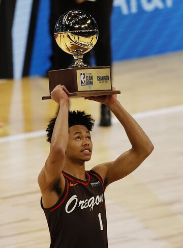 Anfernee Simons of the Portland TrailBlazers celebrates with the trophy after winning the Slam Dunk Contest during halftime of the NBA All-Star Game at State Farm Arena in Atlanta, Georgia.