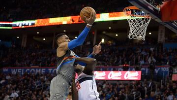 Jan 25, 2018; Oklahoma City, OK, USA; Oklahoma City Thunder guard Russell Westbrook (0) drives to the basket in front of Washington Wizards center Ian Mahinmi (28) during the fourth quarter at Chesapeake Energy Arena. Mandatory Credit: Mark D. Smith-USA TODAY Sports