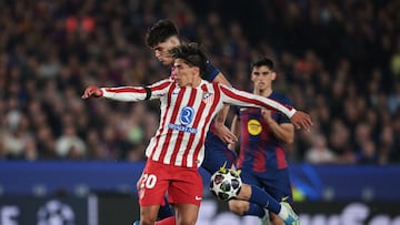 BARCELONA, SPAIN - APRIL 08: Giuliano Simeone of Atletico de Madrid is challenged by Pau Cubarsi of FC Barcelona which results in a yellow card being shown to Pau Cubarsi before being upgraded to a red card following a VAR review during the UEFA Champions League 2025/26 Quarter-Final First Leg match between FC Barcelona and Club Atlético de Madrid at Camp Nou on April 08, 2026 in Barcelona, Spain. (Photo by Eric Alonso/Getty Images)