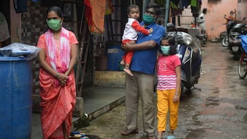 Residents wait to get themselves checked during a COVID-19 coronavirus screening in the Dharavi slum in Mumbai on August 11, 2020. (Photo by INDRANIL MUKHERJEE / AFP)