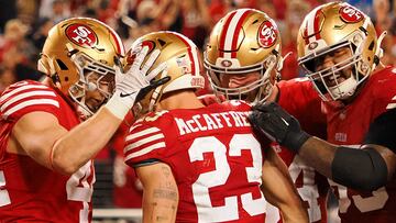 Jan 28, 2024; Santa Clara, California, USA; San Francisco 49ers running back Christian McCaffrey (23) is congratulated after scoring a touchdown against the Detroit Lions during the second half of the NFC Championship football game at Levi's Stadium. Mandatory Credit: Kelley L Cox-USA TODAY Sports