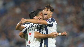 Monterrey's Argentine forward #07 German Berterame celebrates after scoring his team's third goal with teammate Spanish midfielder #08 Oliver Torres during the Liga MX Apertura football match between Monterrey and Juarez at the BBVA Stadium in Monterrey, Mexico, on October 21, 2025. (Photo by Julio Cesar AGUILAR / AFP)
