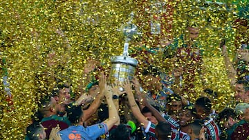 Players of Fluminense celebrate with the trophy after winning the Copa Libertadores final football match between Brazil's Fluminense and Argentina's Boca Juniors at Maracana Stadium in Rio de Janeiro, Brazil, on November 4, 2023. (Photo by SILVIO AVILA / AFP)