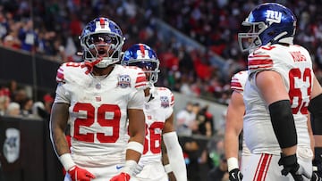 ATLANTA, GEORGIA - DECEMBER 22: Tyrone Tracy Jr. #29 of the New York Giants celebrates his touchdown reception against the Atlanta Falcons with Jake Kubas #63 during the second quarter at Mercedes-Benz Stadium on December 22, 2024 in Atlanta, Georgia. Kevin C. Cox/Getty Images/AFP (Photo by Kevin C. Cox / GETTY IMAGES NORTH AMERICA / Getty Images via AFP)