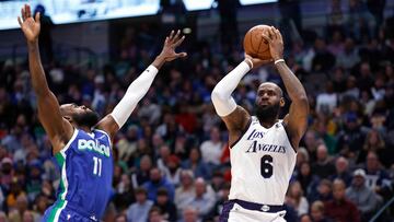 DALLAS, TX - DECEMBER 25: LeBron James #6 of the Los Angeles Lakers shoots the ball as Tim Hardaway Jr. #11 of the Dallas Mavericks defends in the first half at American Airlines Center on December 25, 2022 in Dallas, Texas. NOTE TO USER: User expressly acknowledges and agrees that, by downloading and or using this photograph, User is consenting to the terms and conditions of the Getty Images License Agreement.   Ron Jenkins/Getty Images/AFP (Photo by Ron Jenkins / GETTY IMAGES NORTH AMERICA / Getty Images via AFP)