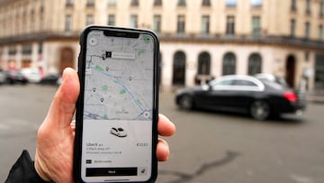 FILE PHOTO: A photo Illustration shows the Uber application on a mobile phone in in central Paris, France March 5, 2020. REUTERS/Gonzalo Fuentes/File Photo