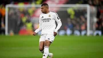 Real Madrid's French forward #09 Kylian Mbappe runs with the ball during the UEFA Champions League football match between Liverpool and Real Madrid at Anfield in Liverpool, north west England on November 27, 2024. (Photo by Oli SCARFF / AFP)