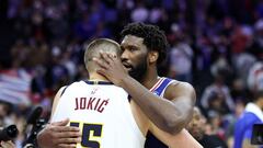 Joel Embiid #21 of the Philadelphia 76ers and Nikola Jokic #15 of the Denver Nuggets speak following a game at the Wells Fargo Center.