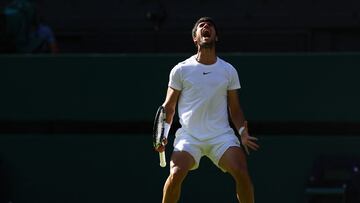 Tennis - Wimbledon - All England Lawn Tennis and Croquet Club, London, Britain - July 12, 2023 Spain's Carlos Alcaraz reacts during his quarter final match against Denmark's Holger Rune REUTERS/Hannah Mckay
